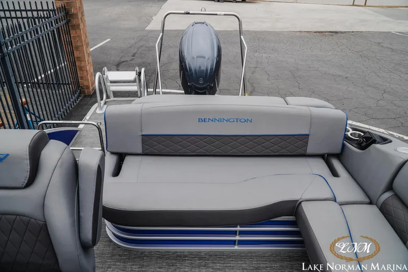 Slide: The Image of 2024 Bennington 23LSB pontoon boat with luxurious seating at Lake Norman Marina. - 13