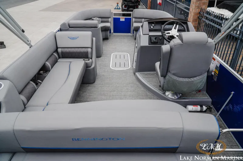 Slide: The Image of 2024 Bennington 23LSB pontoon boat with spacious seating and modern helm at Lake Norman Marina. - 5