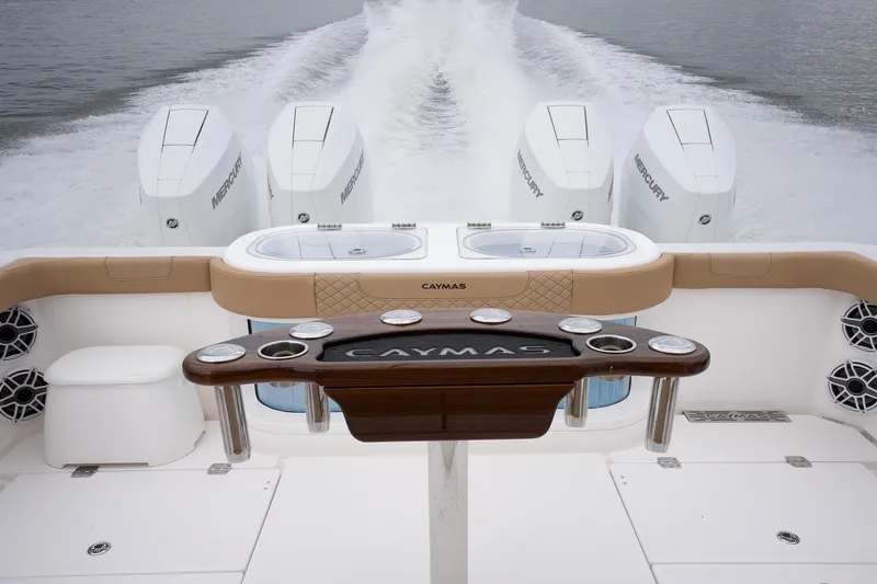 Slide: The Image of 2025 Caymas 44 CT boat with powerful Mercury engines on open water. - 20