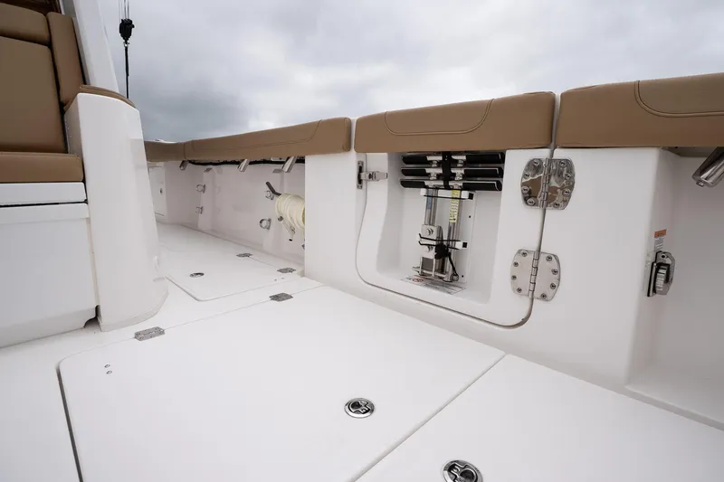 Slide: The Image of 2025 Caymas 44 CT boat interior with white deck and tan seating. - 23