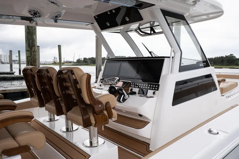 Slide: The Image of 2025 Caymas 44 CT boat interior with modern helm and luxurious seating. - 41