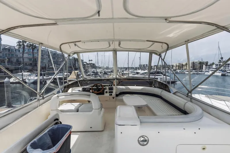 Slide: The Image of Flybridge view of 2000 Viking 46 Sport Cruiser in marina setting. - 14