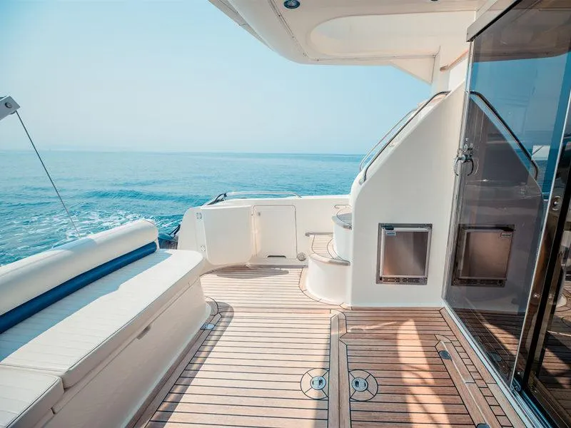 Slide: The Image of Viking 46 Flybridge Sport Cruiser 2000, teak deck, ocean view, luxury yacht interior. - 6