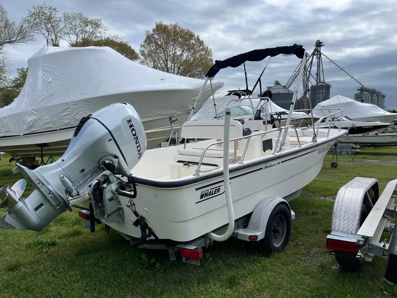 Slide: The Image of 2003 Boston Whaler 170 Montauk boat with Honda outboard motor on trailer. - 8