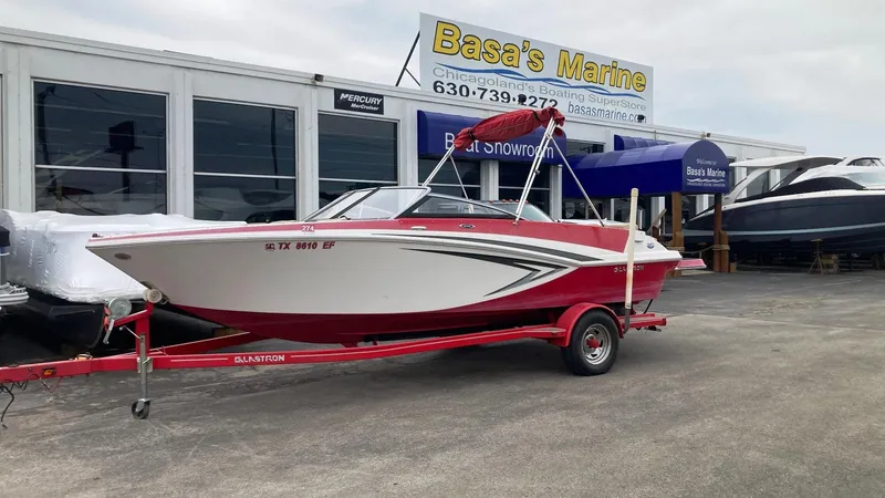 The Image of 2016 Glastron GT 205 boat on red trailer at Basa's Marine dealership. - 0
