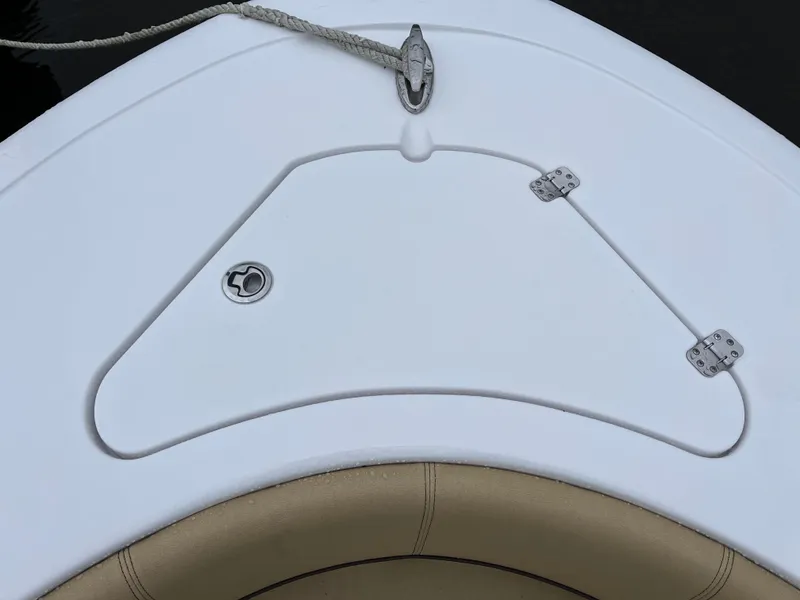 Slide: The Image of 2022 Sportsman Heritage 231 Center Console boat deck with storage hatch and rope. - 10