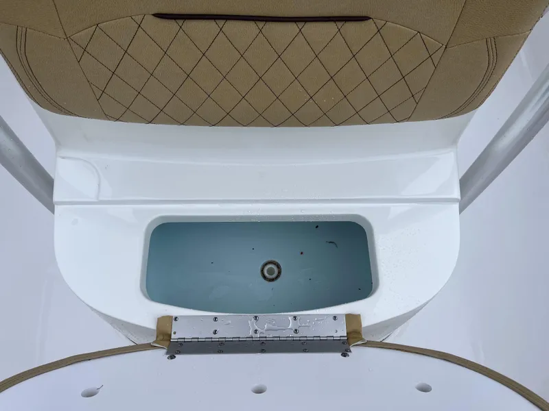 Slide: The Image of 2022 Sportsman Heritage 231 Center Console livewell with cushioned seating. - 13