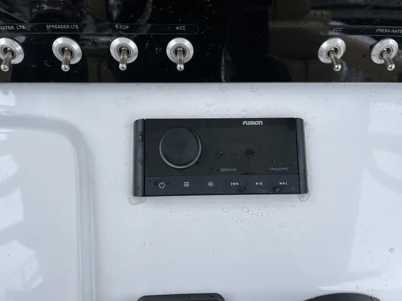 Slide: The Image of 2022 Sportsman Heritage 231 Center Console dashboard with control panel and switches. - 18