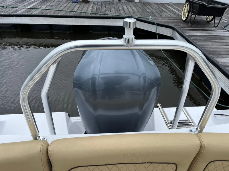 Slide: The Image of 2022 Sportsman Heritage 231 Center Console boat with outboard motor at dock. - 21