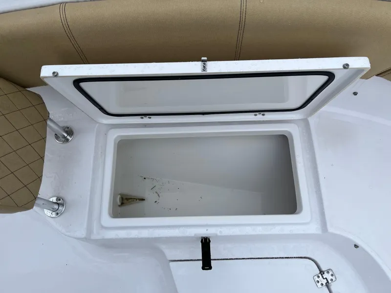 Slide: The Image of Open storage compartment on 2022 Sportsman Heritage 231 Center Console boat. - 28