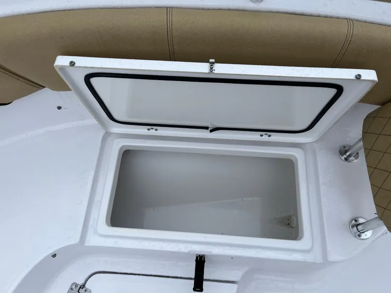 Slide: The Image of Open storage compartment on 2022 Sportsman Heritage 231 Center Console boat. - 29