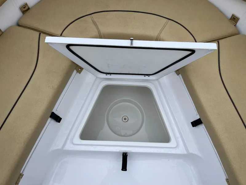 Slide: The Image of Open storage compartment on 2022 Sportsman Heritage 231 Center Console boat. - 9