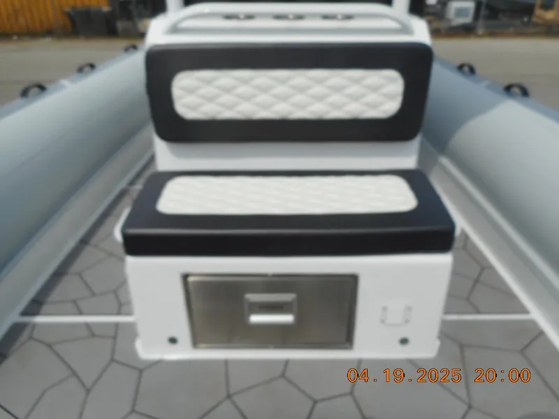 Slide: The Image of 2025 Highfield Sport 760 boat interior with cushioned seating and storage compartment. - 10