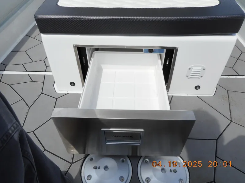 Slide: The Image of Open storage drawer on 2025 Highfield Sport 760 boat, showcasing sleek design and functionality. - 11