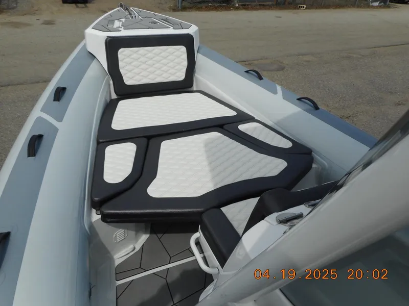 Slide: The Image of 2025 Highfield Sport 760 boat interior with cushioned seating and modern design. - 14