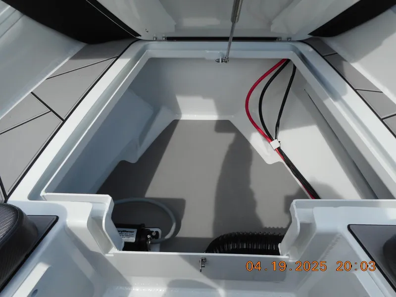 Slide: The Image of Open storage compartment of 2025 Highfield Sport 760 boat, featuring clean interior design. - 16