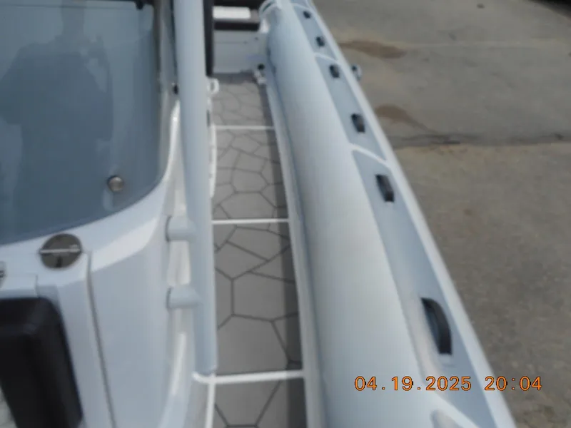 Slide: The Image of 2025 Highfield Sport 760 boat deck with geometric flooring design. - 19