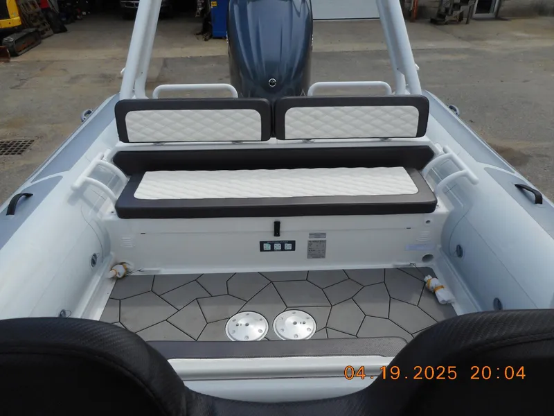Slide: The Image of 2025 Highfield Sport 760 boat interior with cushioned seating and patterned flooring. - 20