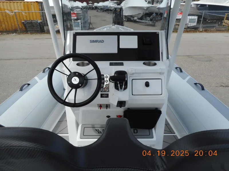 Slide: The Image of 2025 Highfield Sport 760 boat dashboard with steering wheel and controls. - 21