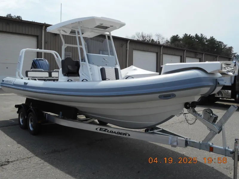 Slide: The Image of 2025 Highfield Sport 760 boat on trailer, parked outdoors. - 3