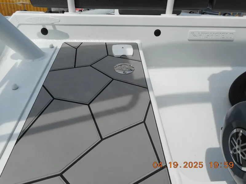 Slide: The Image of 2025 Highfield Sport 760 boat deck with geometric design and logo detail. - 7