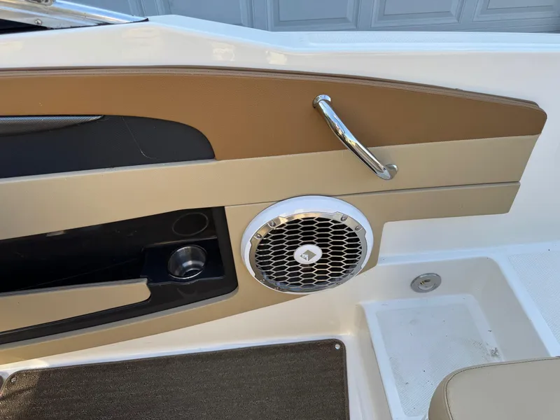 Slide: The Image of Interior detail of 2015 Sea Ray 220 Sundeck boat, featuring speaker and handle. - 22