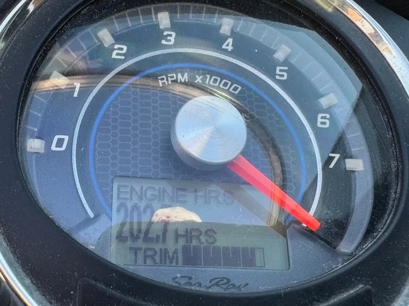 Slide: The Image of Tachometer of 2015 Sea Ray 220 Sundeck showing engine hours and RPM. - 8
