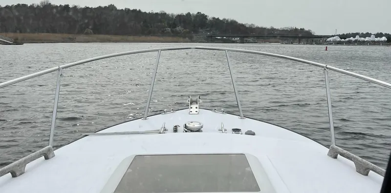 Slide: The Image of Bow view of a 2007 Eastern 27 boat on a calm lake. - 15