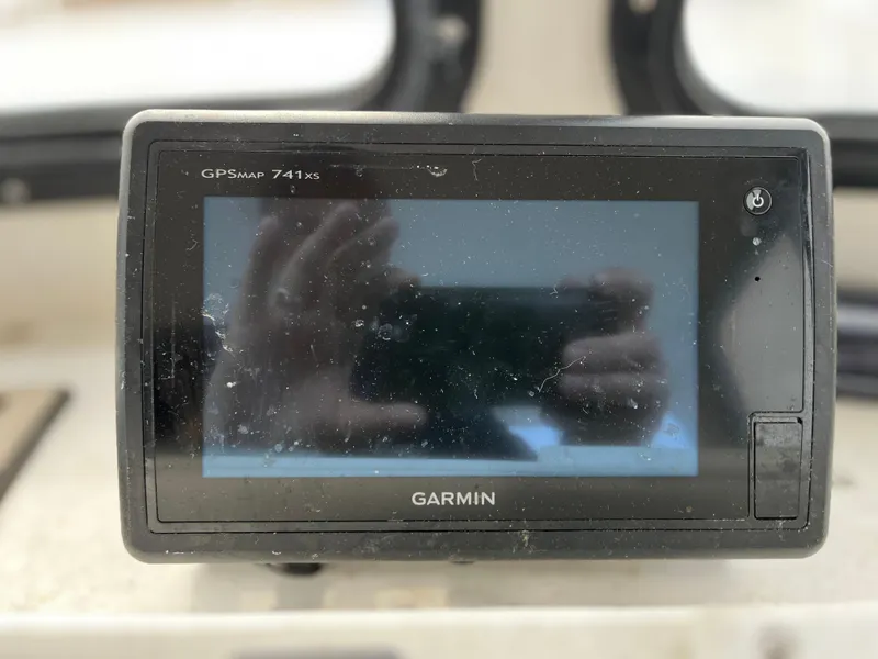 Slide: The Image of Garmin GPSmap 741xs device on a 2007 Eastern 27 boat dashboard. - 19