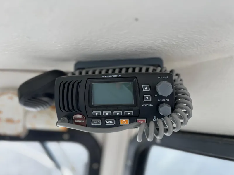 Slide: The Image of Boat radio equipment inside a 2007 Eastern 27 model, mounted on the ceiling. - 20