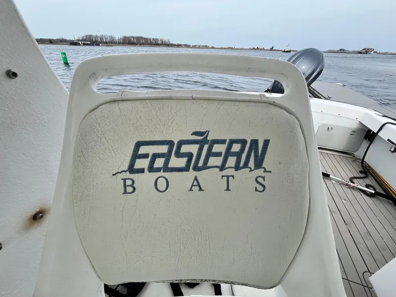 Slide: The Image of Boat seat with "Eastern Boats" logo, Eastern 27 model, 2007, on a calm water background. - 5