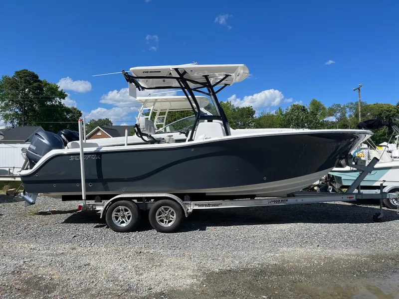 Slide: The Image of 2021 Sea Fox 248 Commander boat on trailer under clear blue sky. - 0