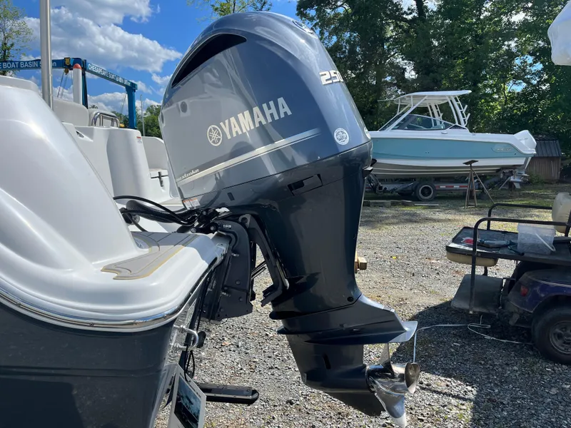 Slide: The Image of 2021 Sea Fox 248 Commander with Yamaha 250 outboard motor in a boatyard setting. - 1