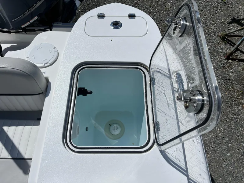 Slide: The Image of 2021 Sea Fox 248 Commander boat with open storage compartment and seating. - 13