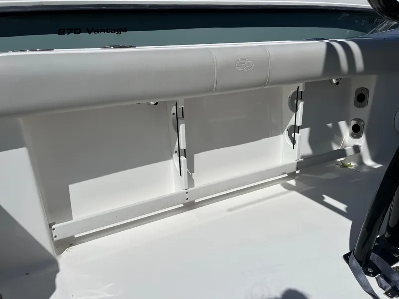 Slide: The Image of 2021 Sea Fox 248 Commander boat interior with storage compartments and cushioned seating. - 15