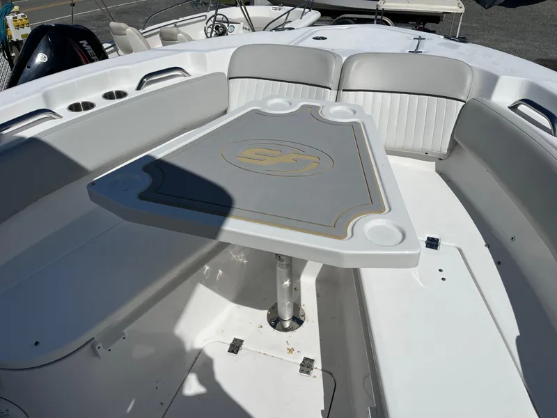 Slide: The Image of 2021 Sea Fox 248 Commander boat interior with seating and table setup. - 17