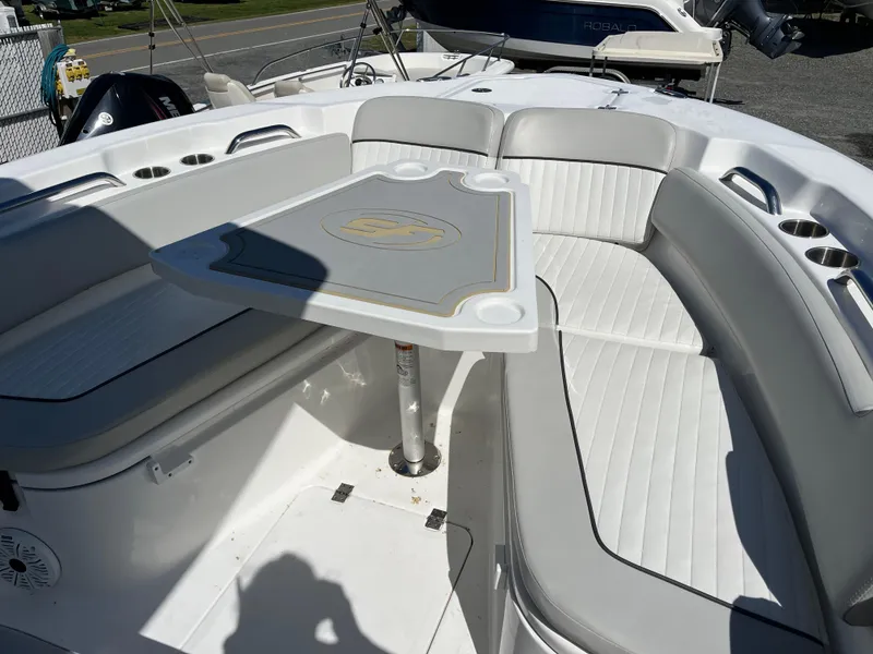 Slide: The Image of 2021 Sea Fox 248 Commander boat interior with white seating and table. - 18