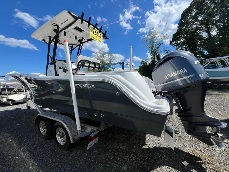 Slide: The Image of 2021 Sea Fox 248 Commander boat with Yamaha engine on trailer, under clear blue sky. - 25