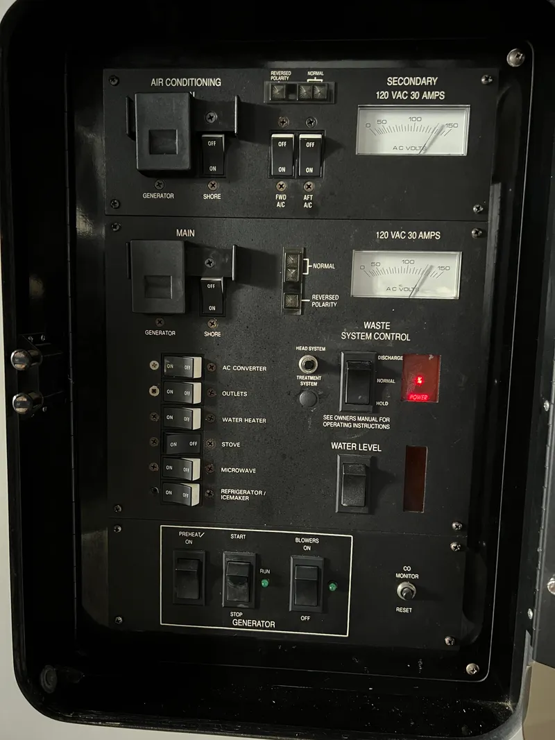 Slide: The Image of Electrical control panel on a 1991 Sea Ray 350 Sundancer boat. - 31