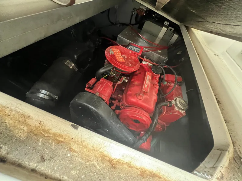 Slide: The Image of Engine compartment of a 1991 Sea Ray 350 Sundancer with a red engine. - 32