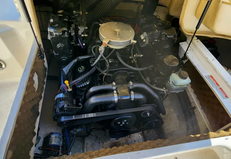 Slide: The Image of Engine compartment of a 2001 Sea Ray 210 SD boat, showcasing mechanical components. - 4