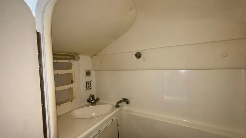 Slide: The Image of 2002 Black Thunder 460 EC boat bathroom with sink and faucet. - 13