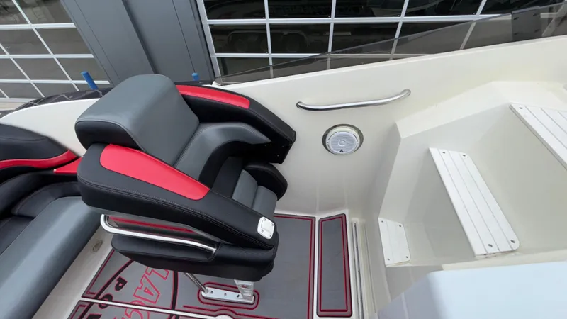 Slide: The Image of 2002 Black Thunder 460 EC boat interior with black and red seating. - 23