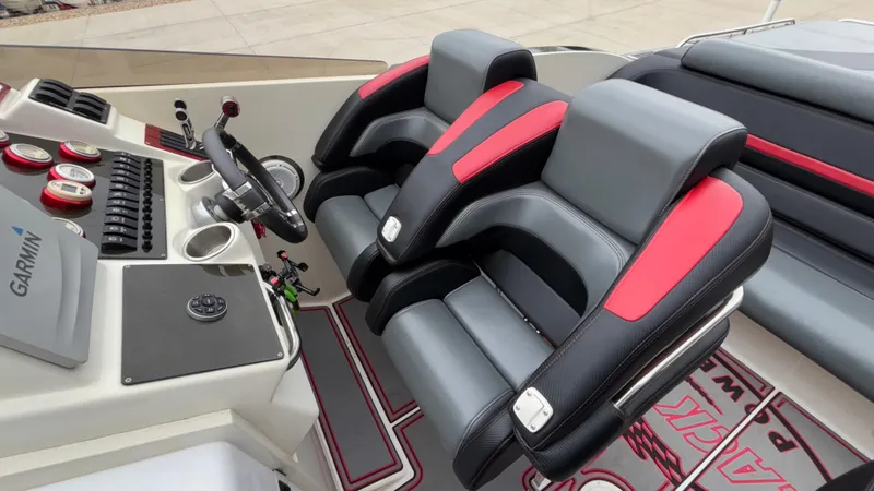 Slide: The Image of Luxury cockpit of 2002 Black Thunder 460 EC with modern controls and plush seating. - 26