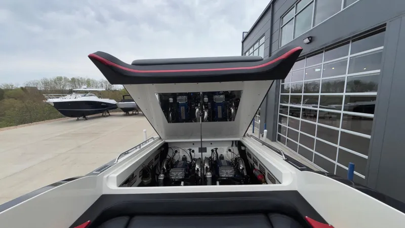 Slide: The Image of Open engine compartment of 2002 Black Thunder 460 EC boat, showcasing powerful engines. - 29