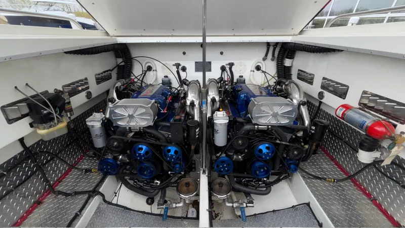 Slide: The Image of Twin engines in a 2002 Black Thunder 460 EC boat, showcasing detailed mechanical components. - 30