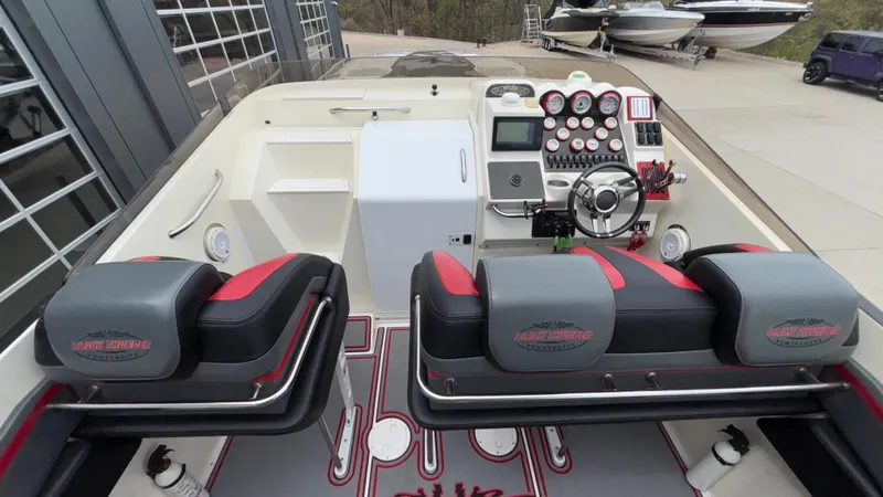 Slide: The Image of 2002 Black Thunder 460 EC boat interior with modern dashboard and seating. - 31