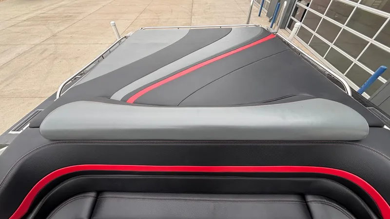Slide: The Image of 2002 Black Thunder 460 EC boat interior with sleek black, gray, and red upholstery design. - 35