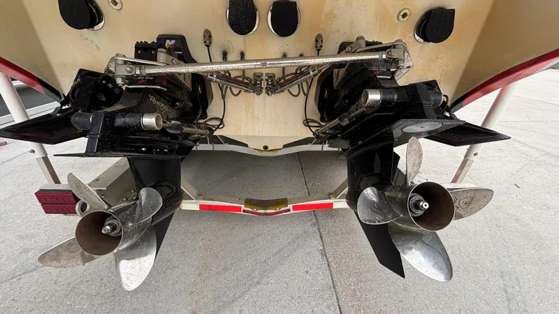 Slide: The Image of Rear view of 2002 Black Thunder 460 EC boat showing dual propellers and outboard motors. - 43