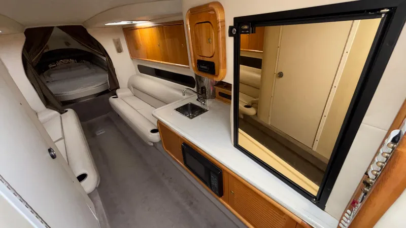 Slide: The Image of Interior of 2002 Black Thunder 460 EC boat with modern amenities and comfortable seating. - 8